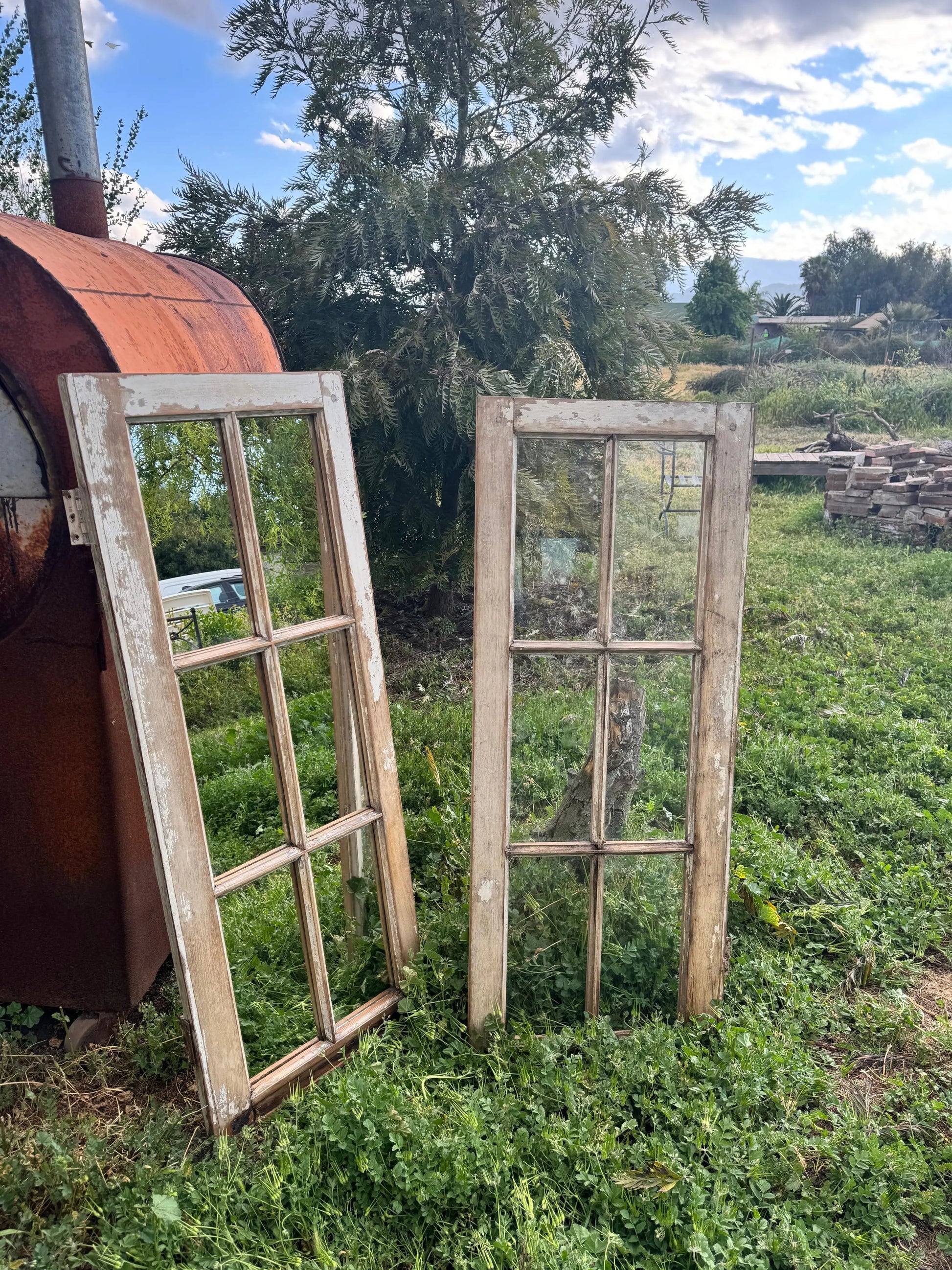 Espejo_de_ventana_y_ventana_vertical